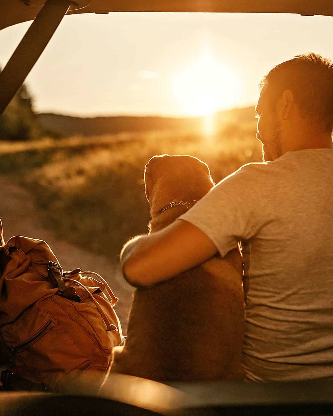 Young man enjoying financial freedom with dog