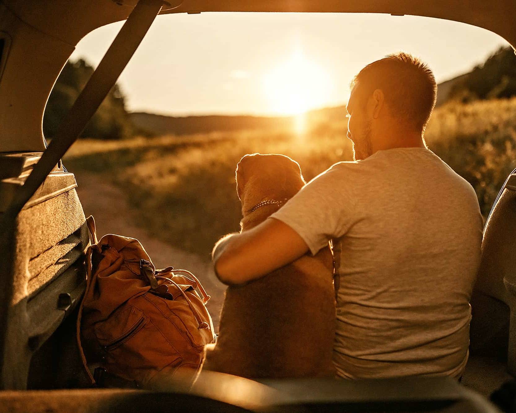 Young man enjoying financial freedom with dog