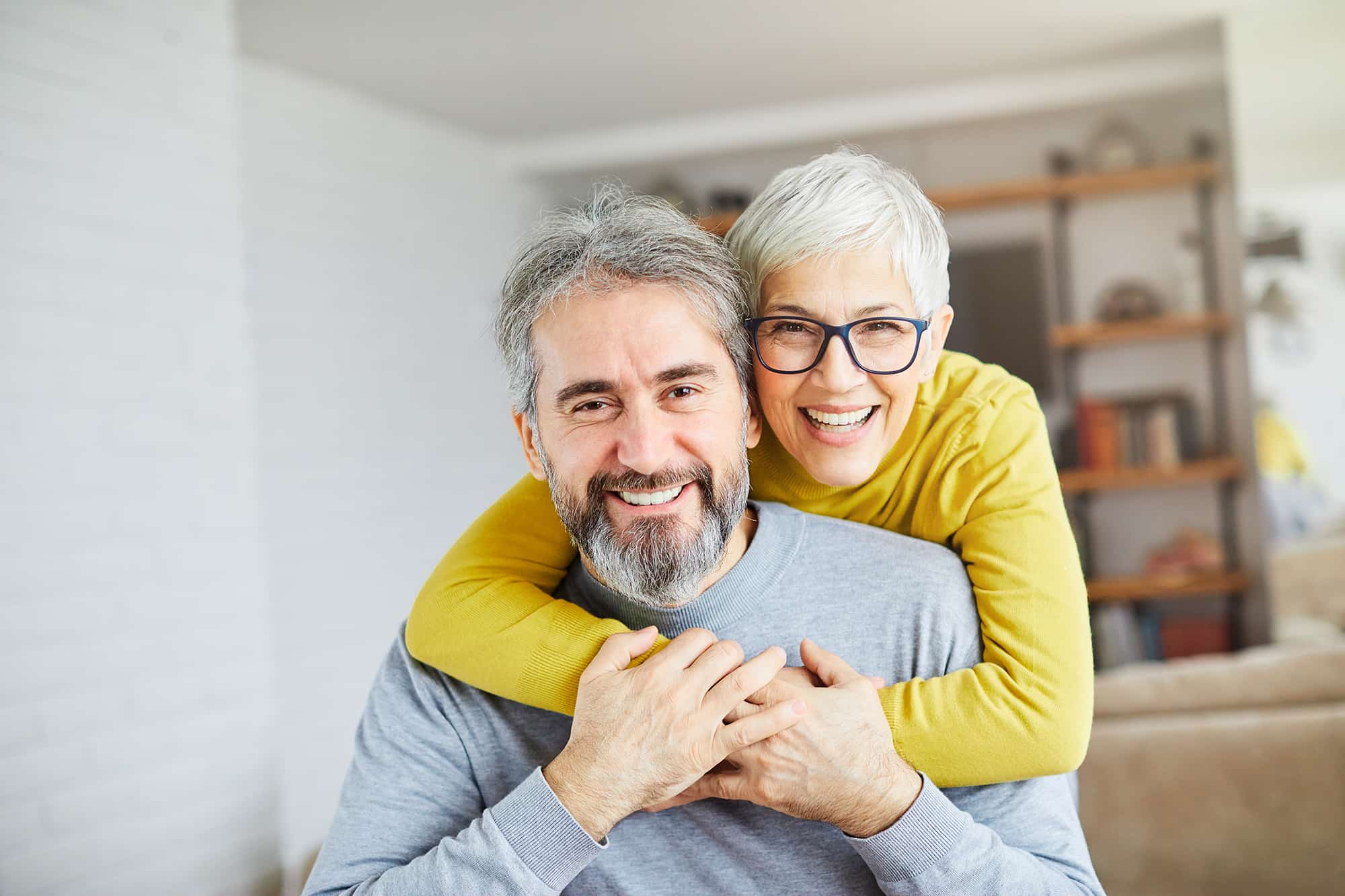Happy older couple thanks to financial planning
