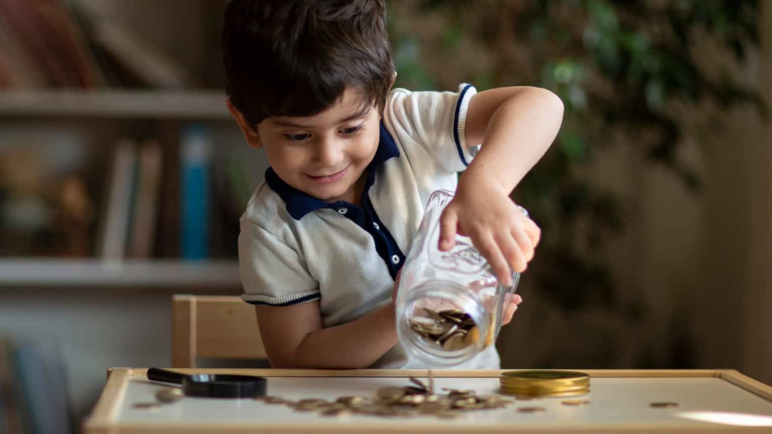 Young child starting investing and saving when young