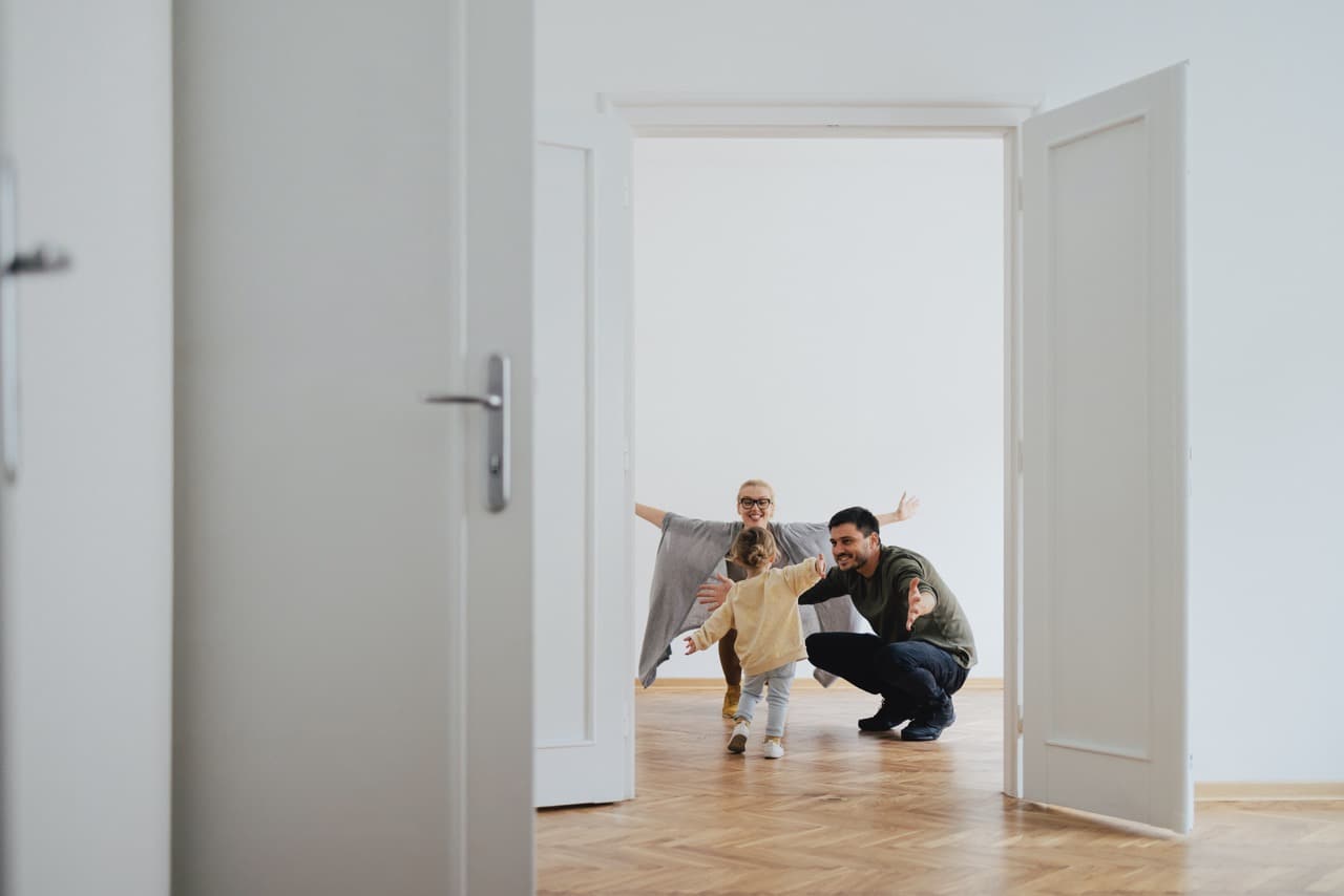 Young family with open arms