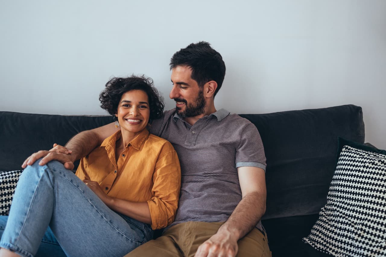Couple sat on the sofa together