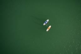 Drone image of two padlleboarlers