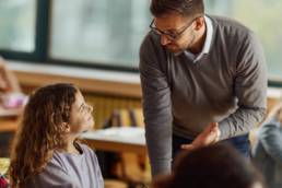 Teacher speaking to student