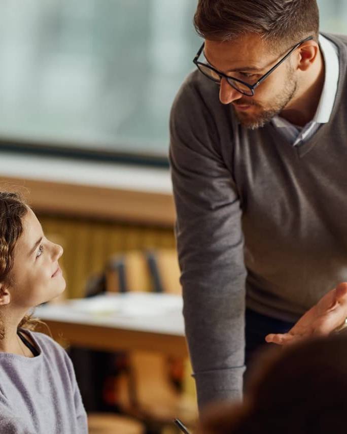 Teacher speaking to student
