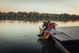 Family relaxing by the water