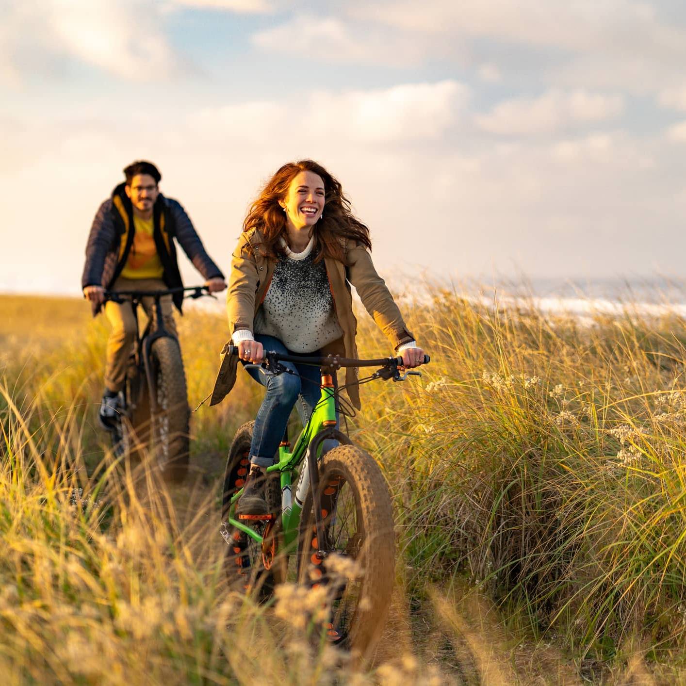 Couple cycling along a coastal path, illustrating long-term pension planning after the proposed Inheritance Tax changes.