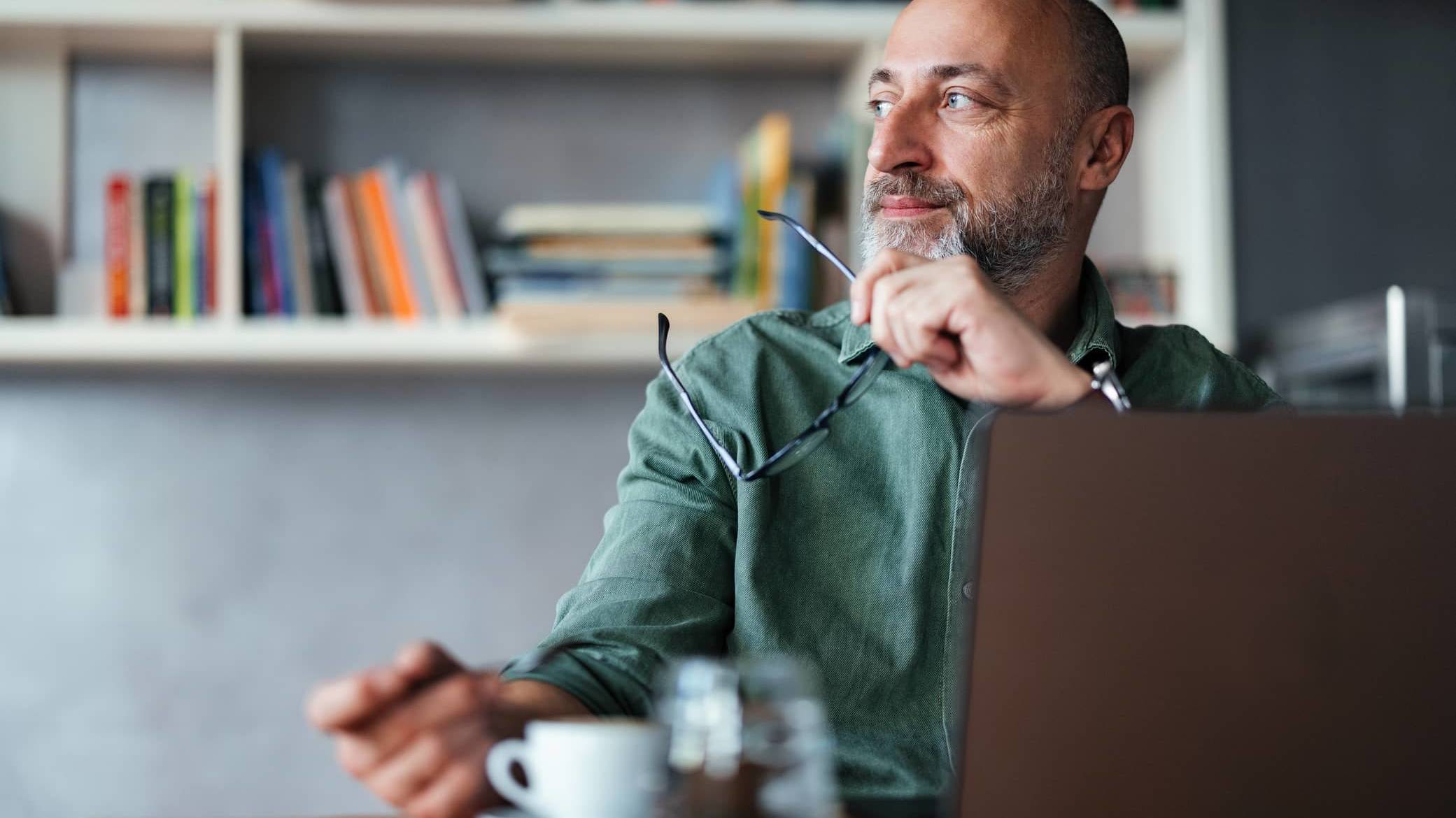 Man in his 50s considering his financial options after redundancy