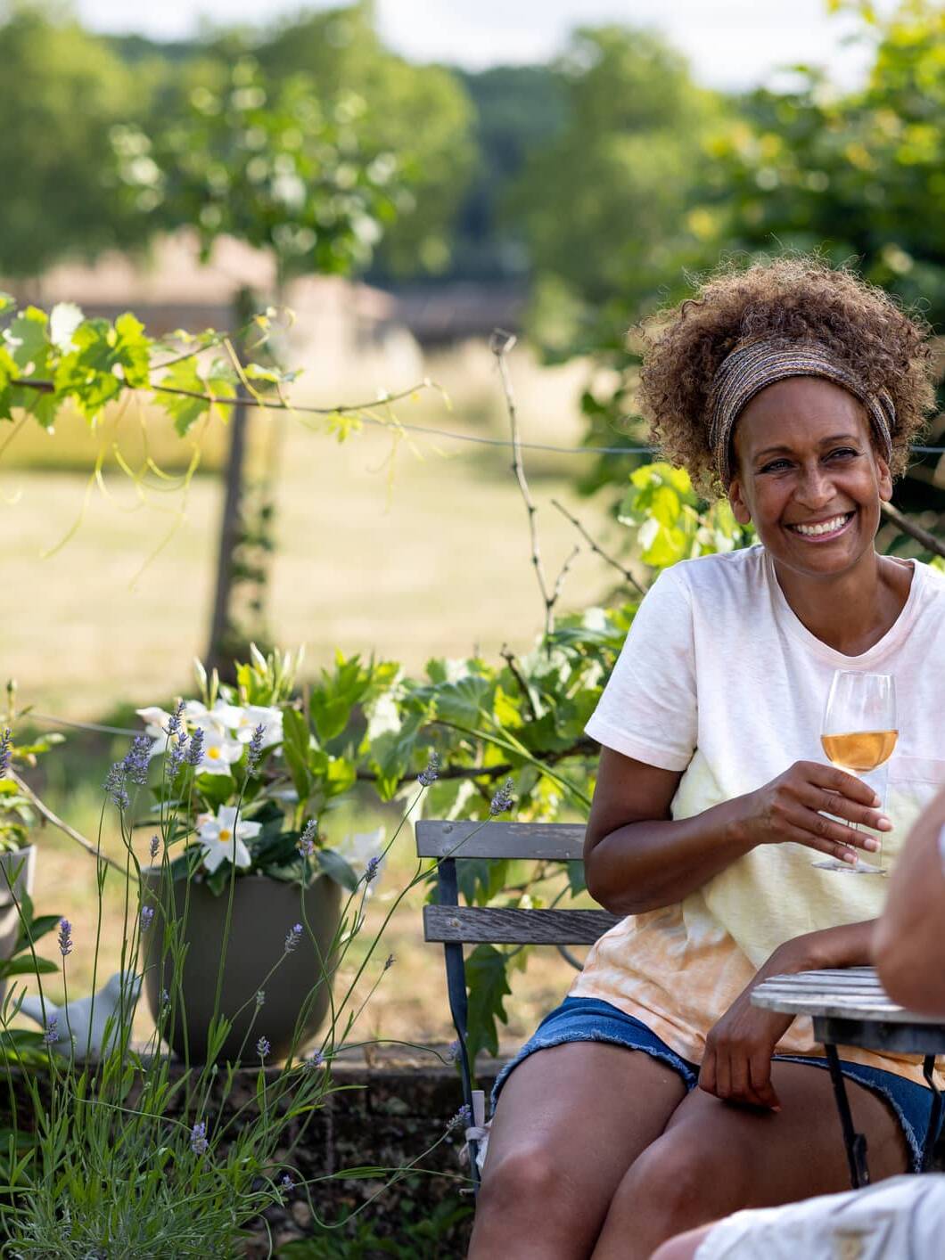 Couple relaxing outdoors with a glass of wine in retirement