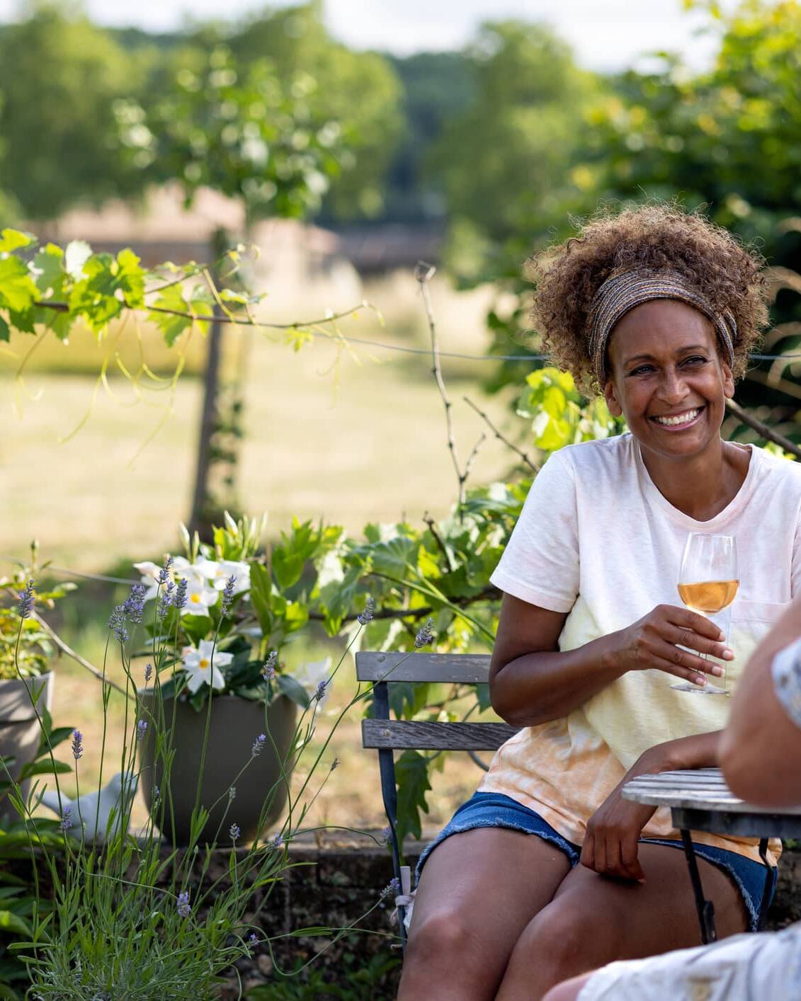 Couple relaxing outdoors with a glass of wine in retirement
