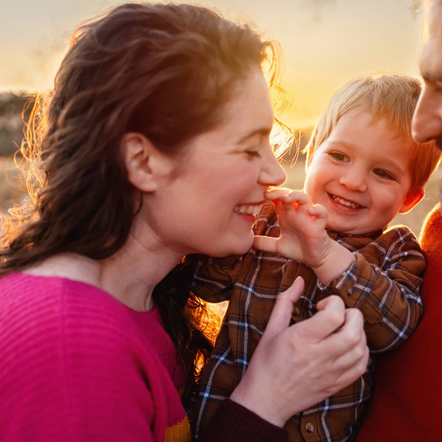 Parents enjoying time outdoors with their young child