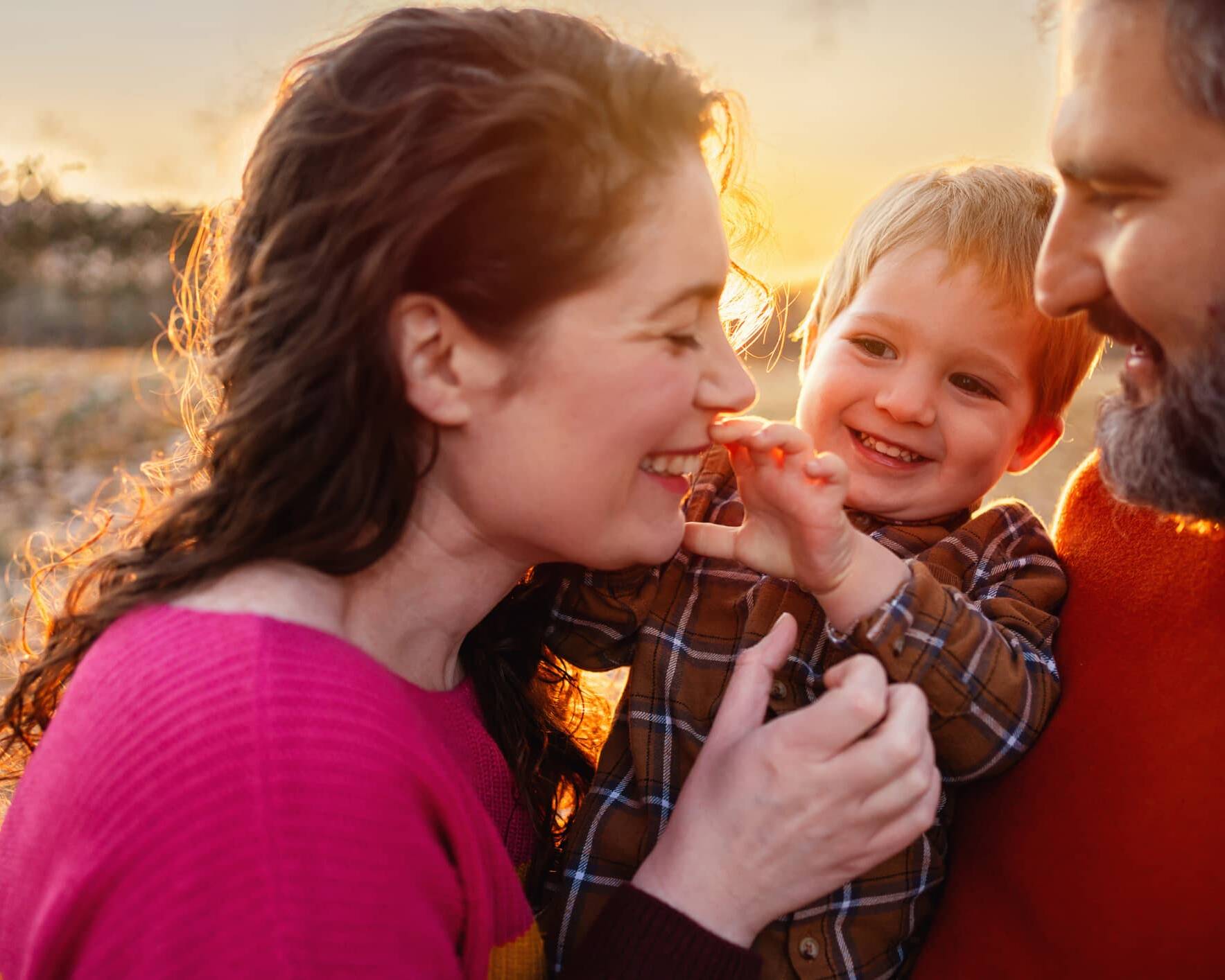 Parents enjoying time outdoors with their young child