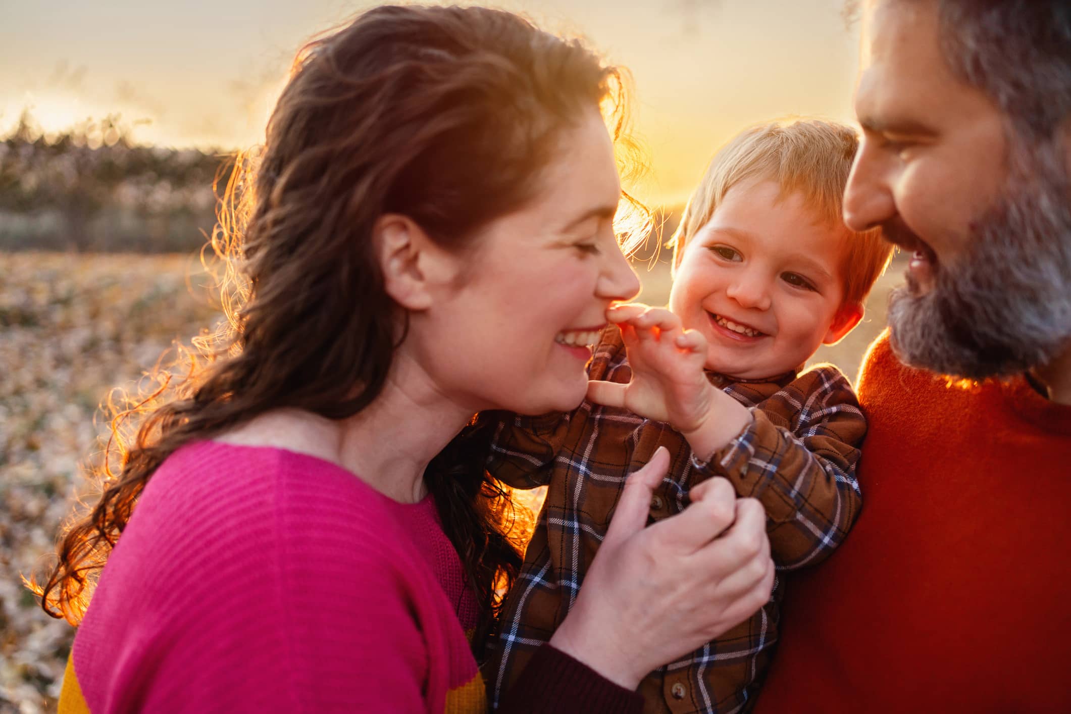 Parents enjoying time outdoors with their young child